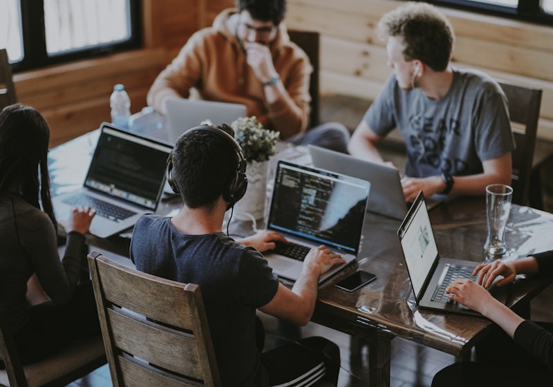 Diverse team of researchers collaborating around a table